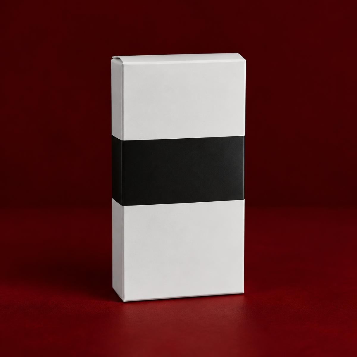 A plain white carton with a black band on a dark red studio background